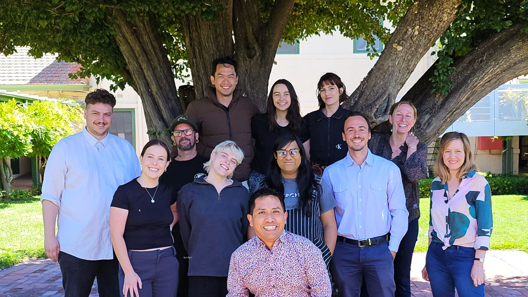 Arts Capital staff under the heritage-listed Hawthorn tree.
