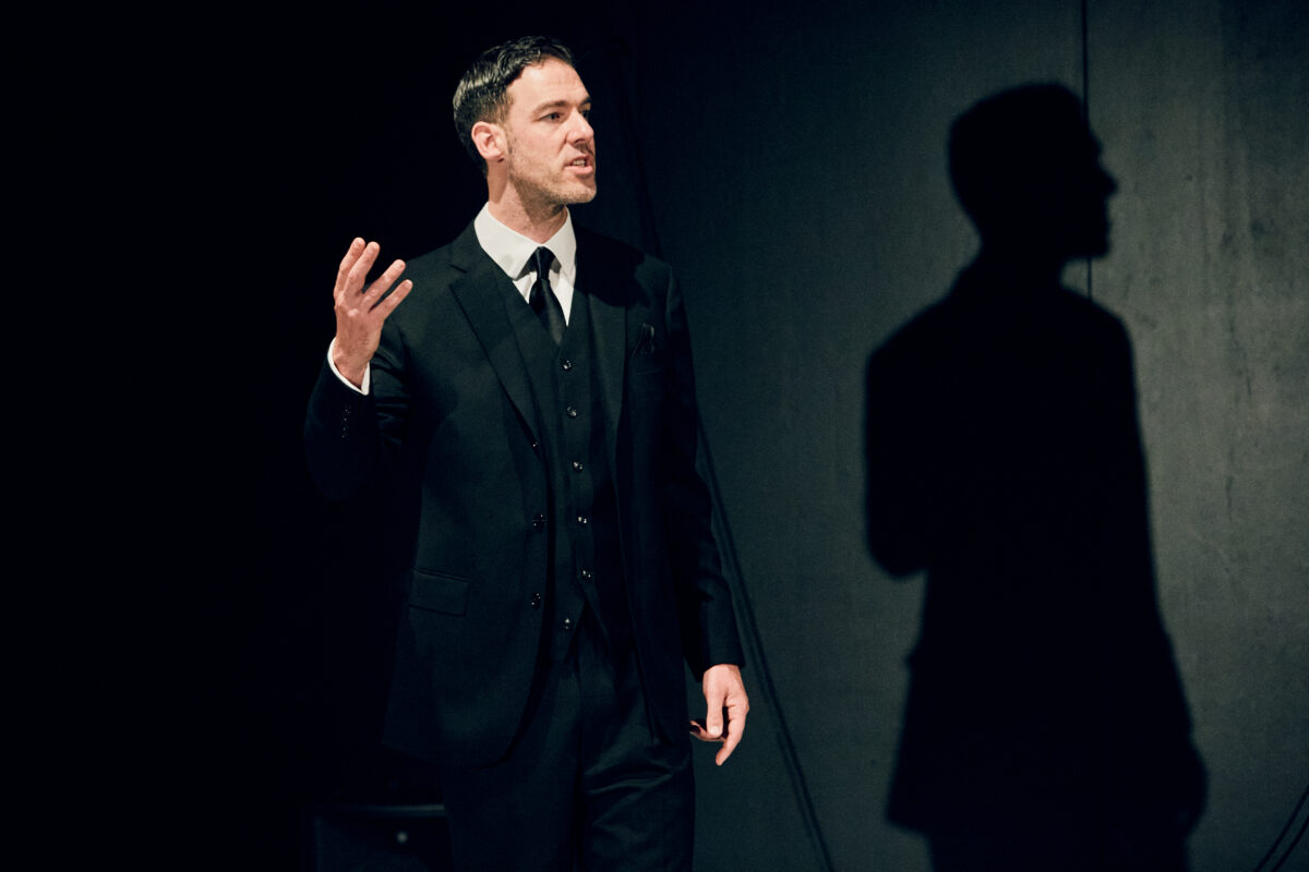 A man with his hand up