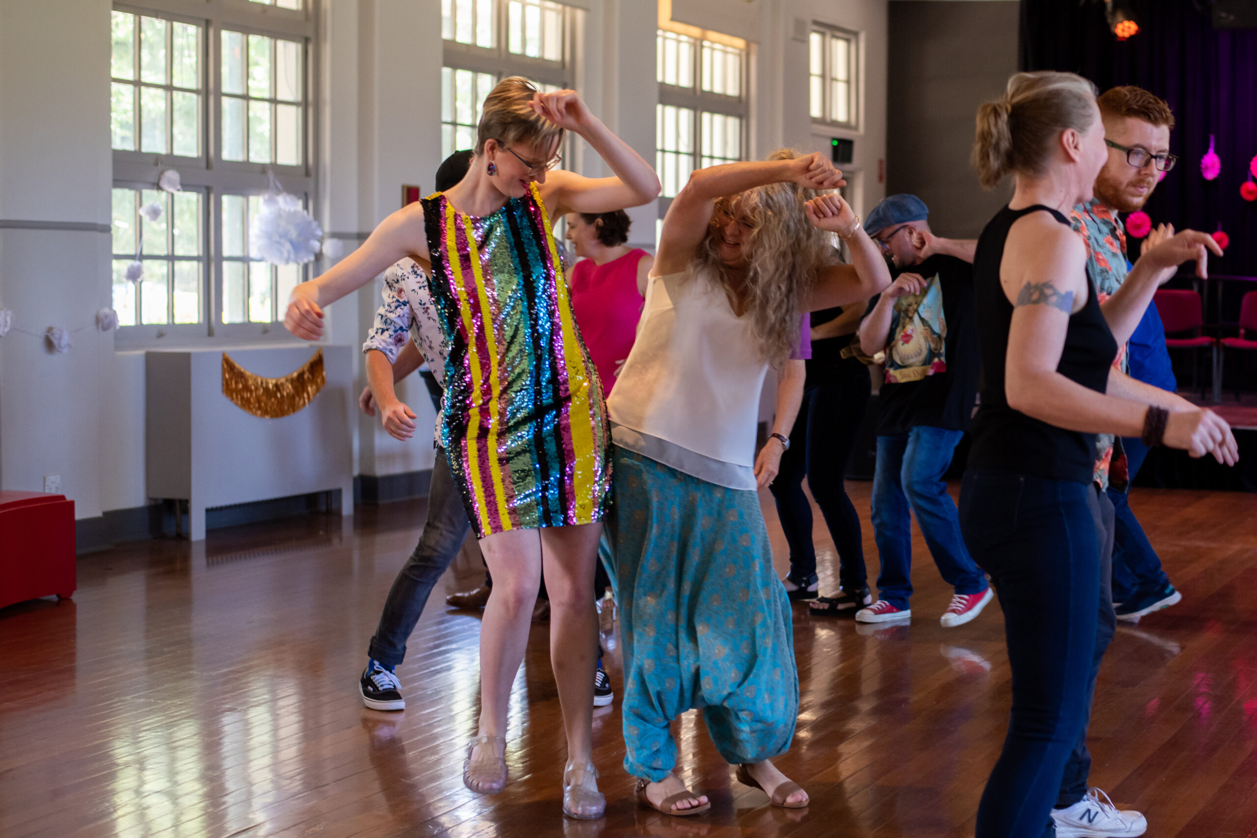 Two people dancing and having fun at Ainslie Main Hall