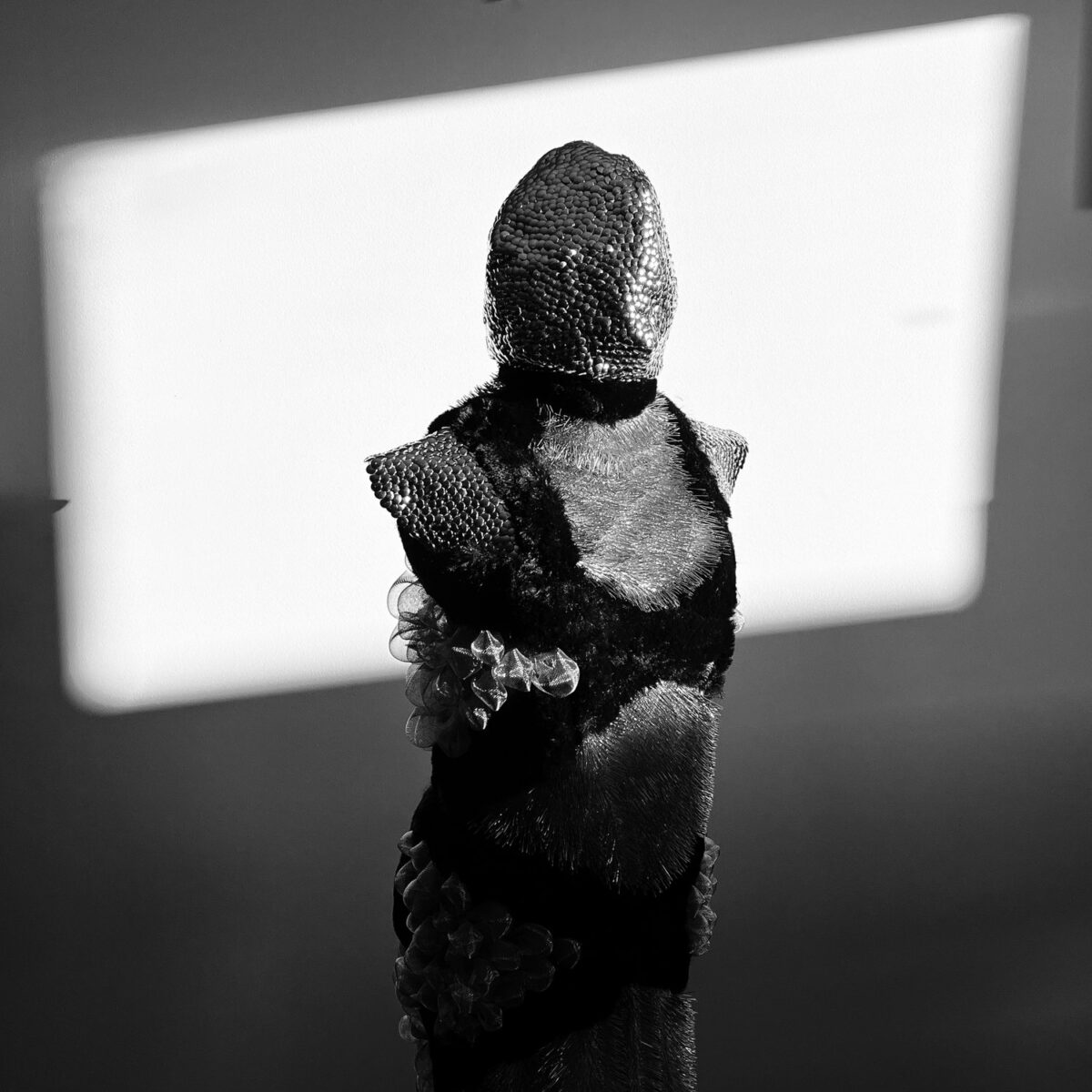 Tributary Projects A head of a mannequin wrapped with fur and jewels