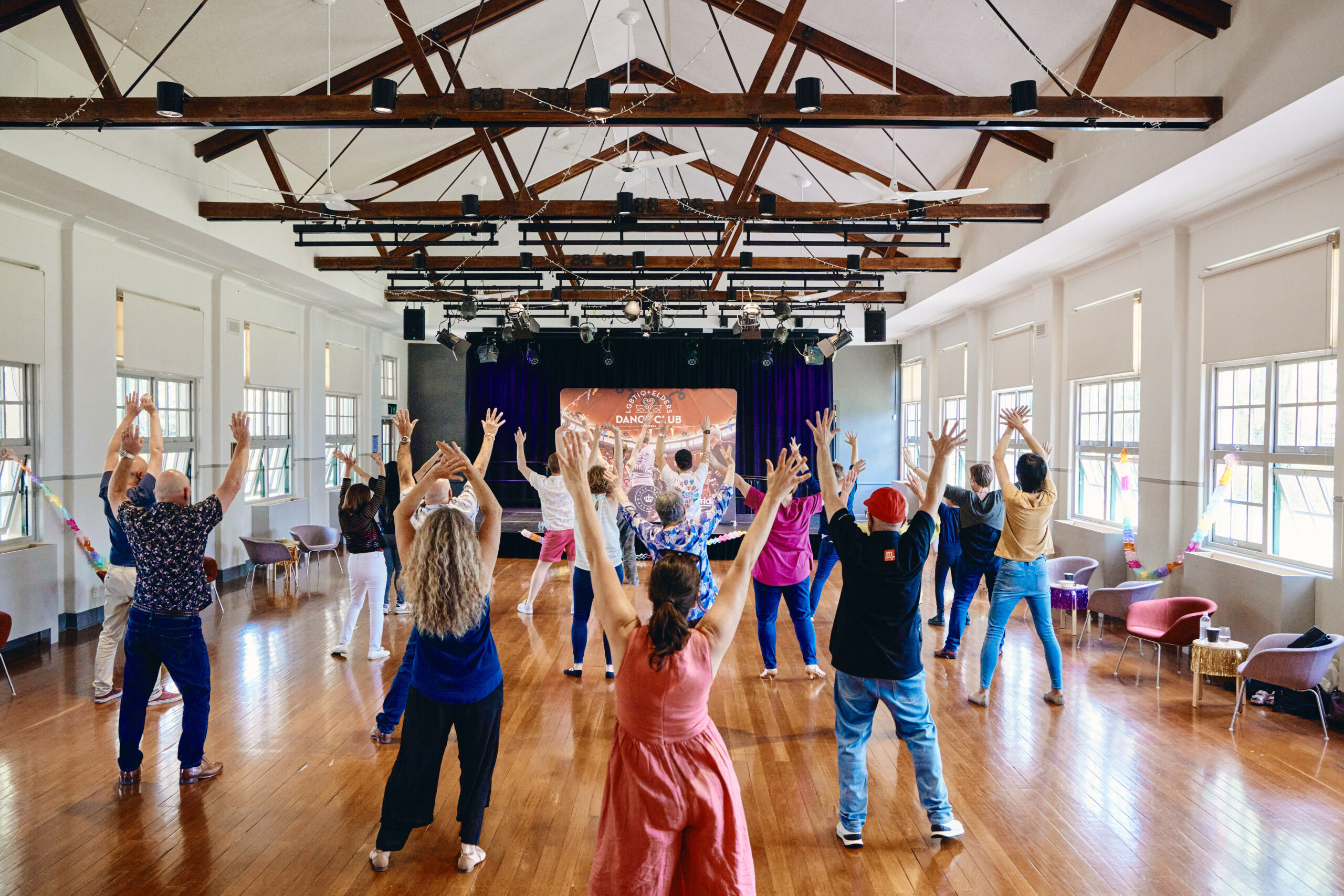 Adults dancing happily.