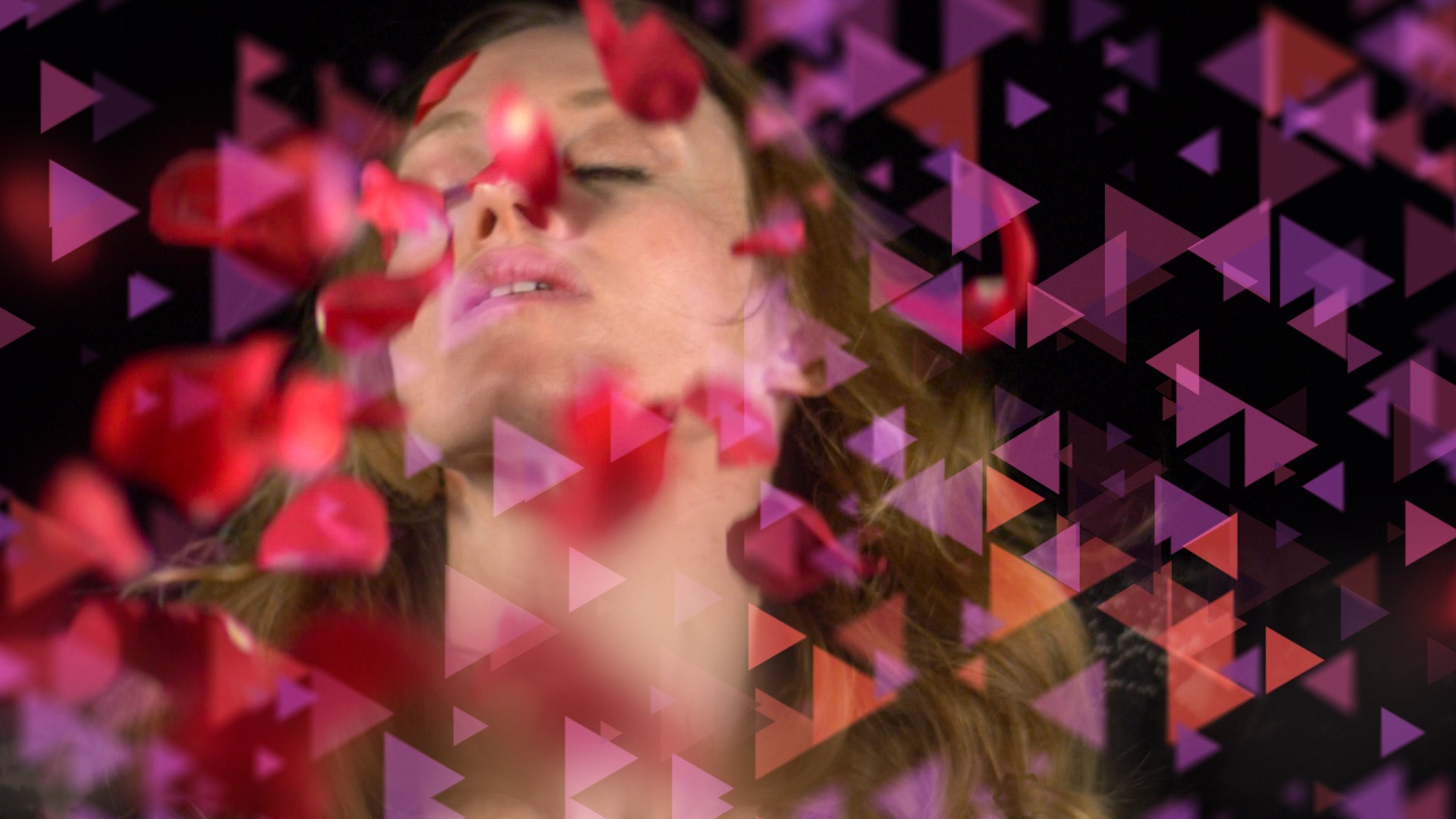 Triangle graphics are interpresed across the screen and a person blurring the background