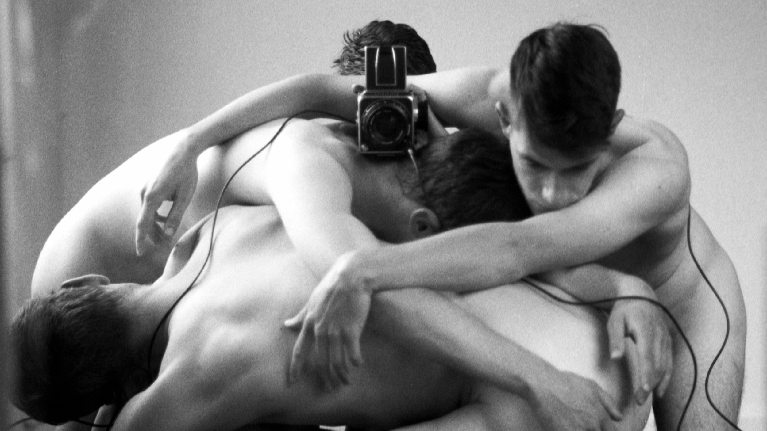 Black and White image of bodies interwined.